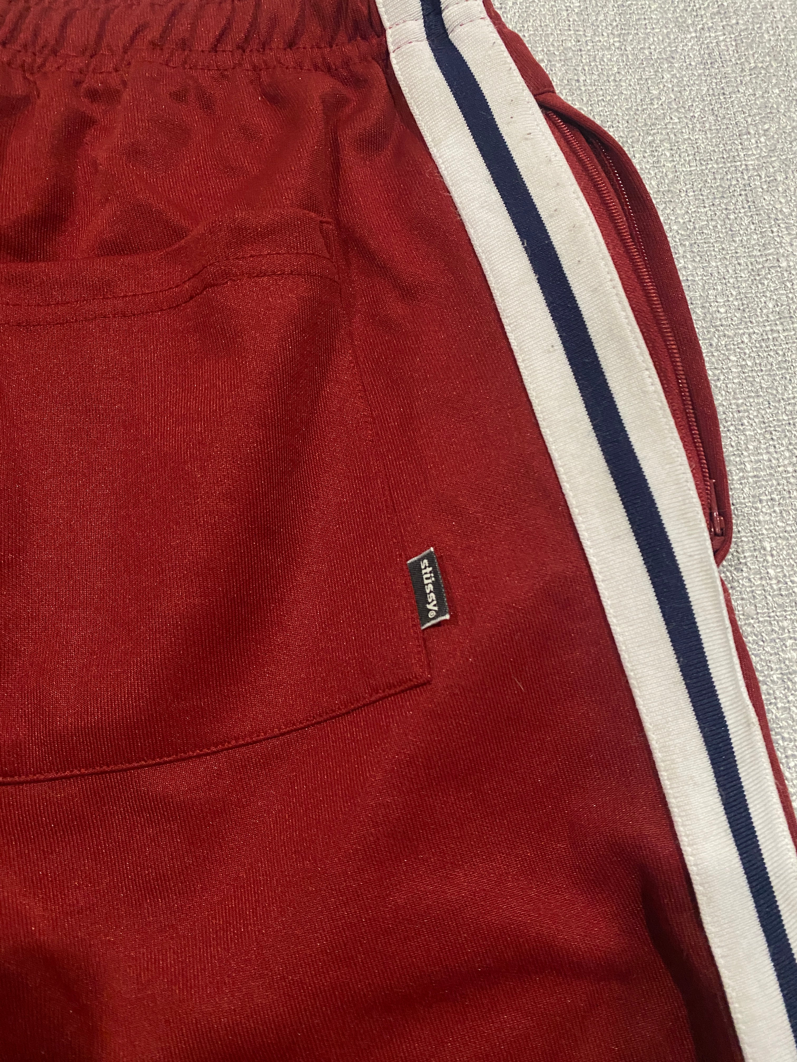 Stüssy Red Track Pants with White and Navy Side Stripes