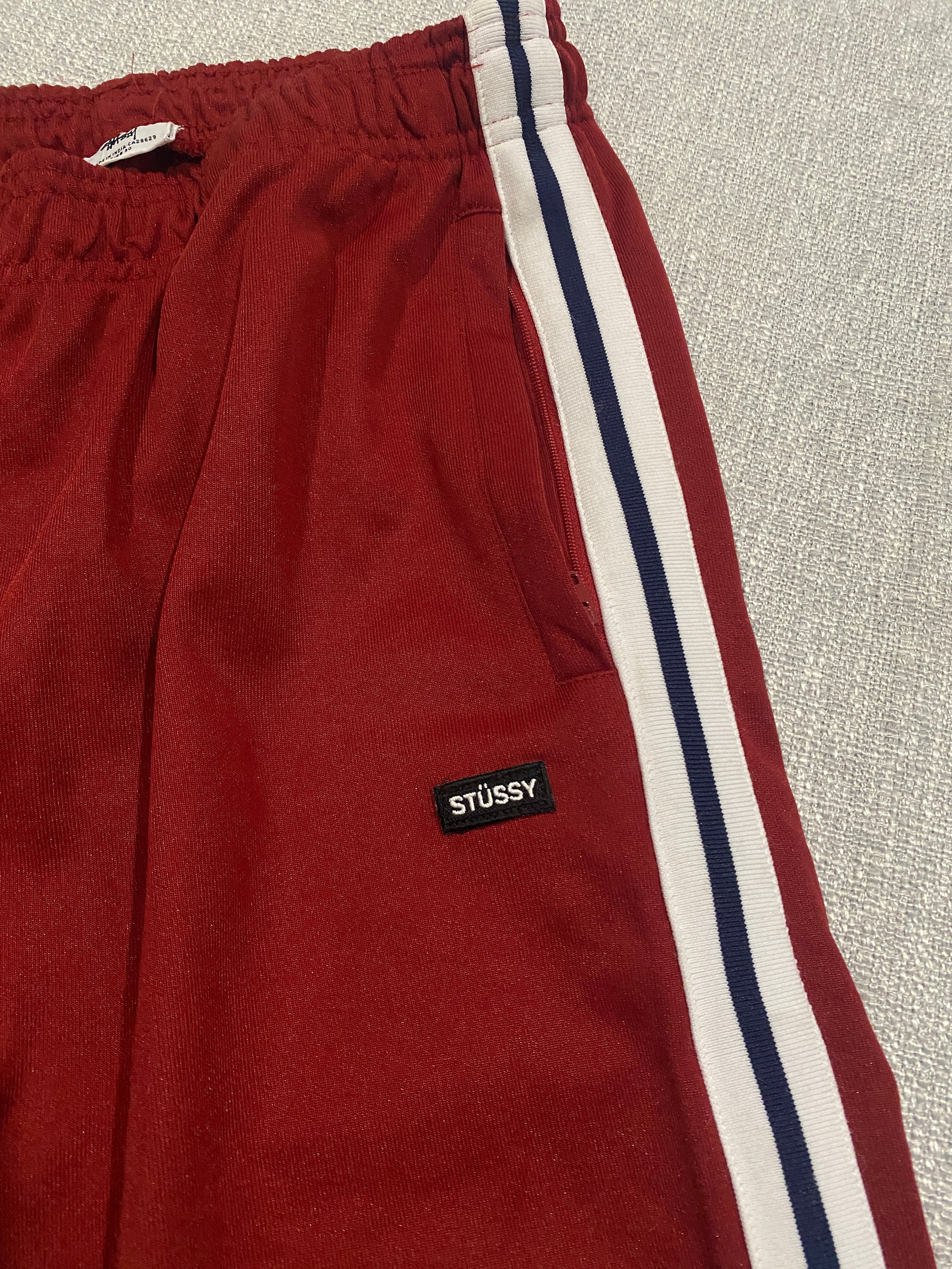 Stüssy Red Track Pants with White and Navy Side Stripes