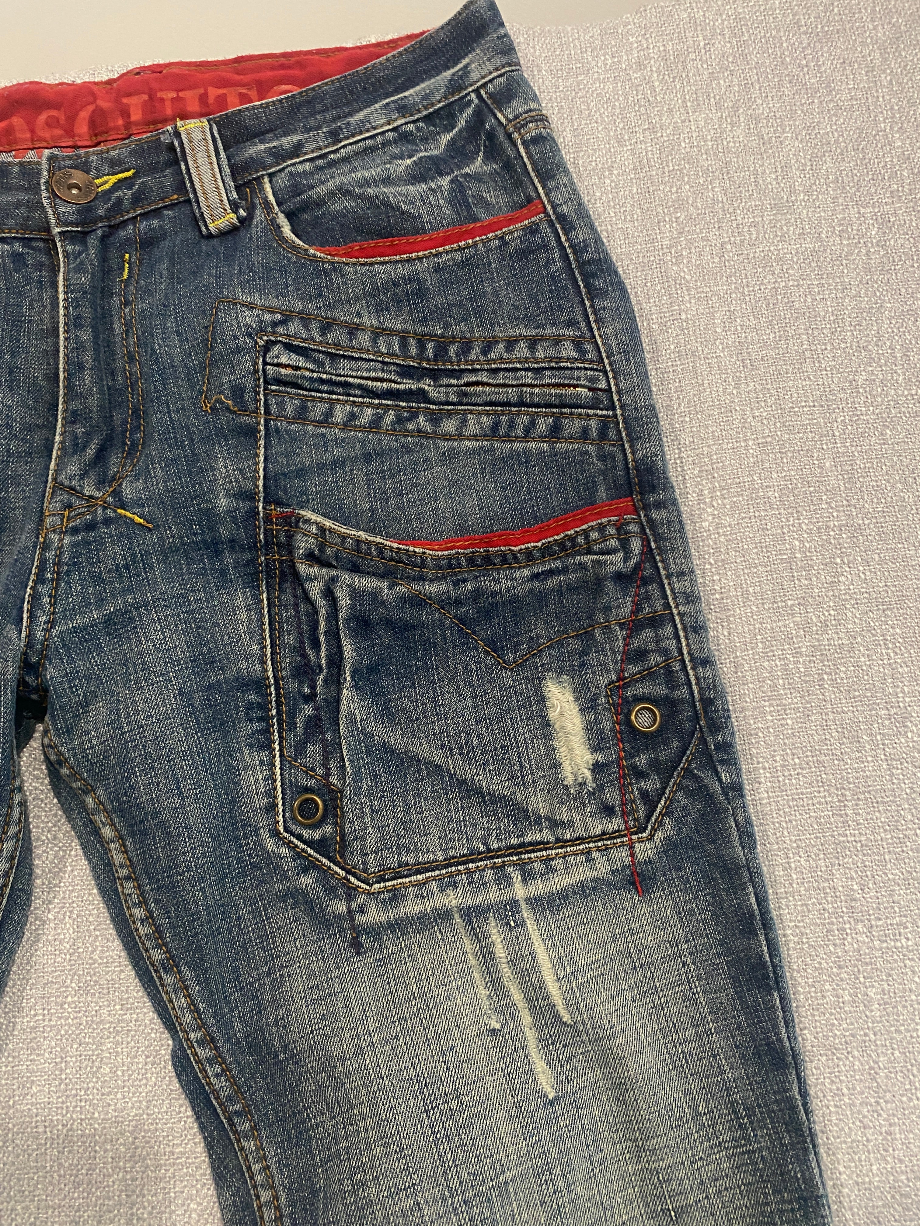 Mosquito Distressed Multi-Pocket Blue Jeans with Red Accents