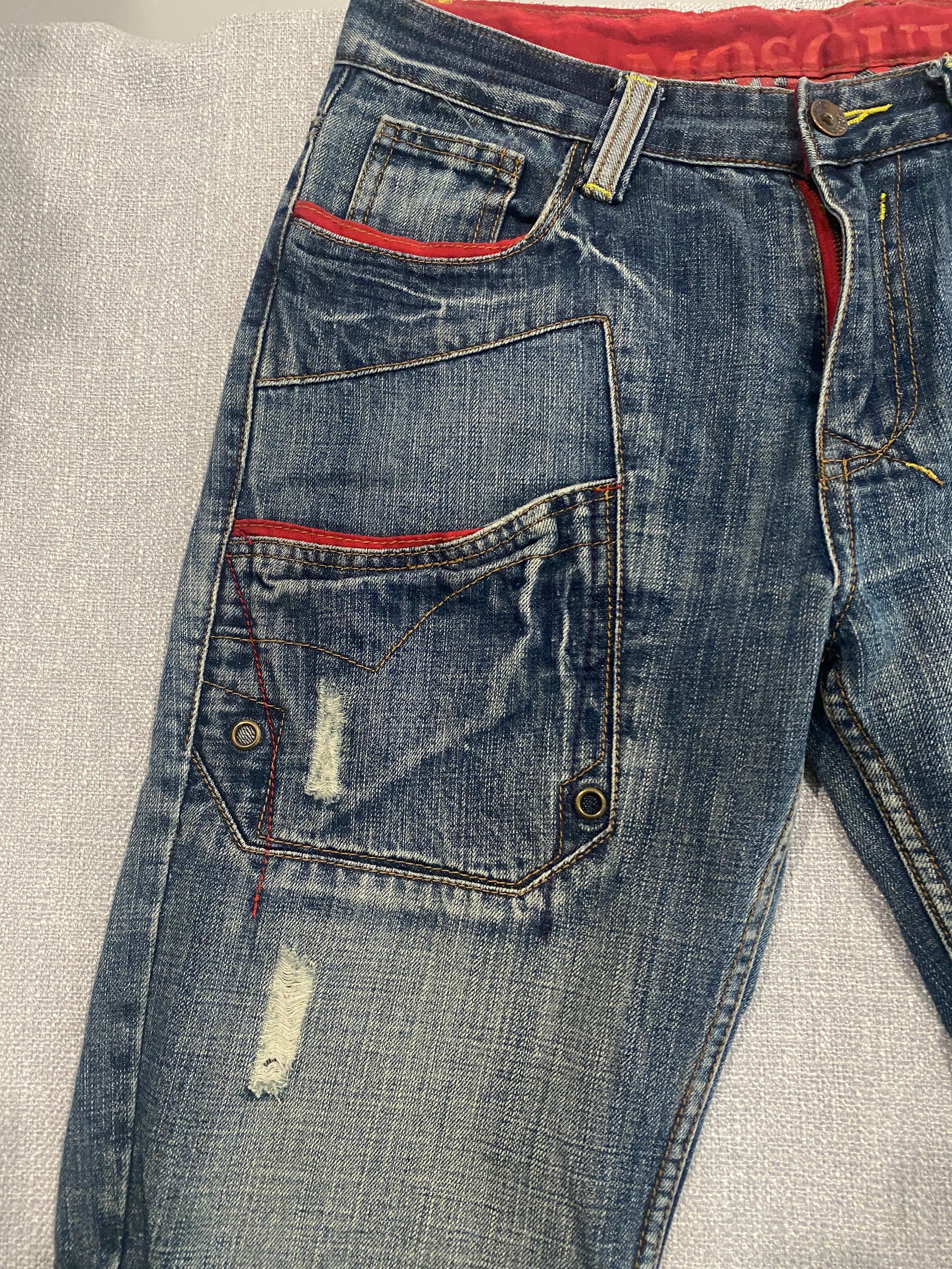 Mosquito Distressed Multi-Pocket Blue Jeans with Red Accents
